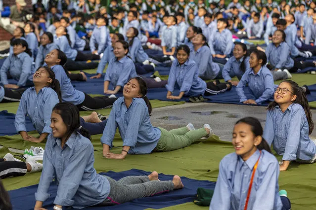 Exile Tibetan students of the Tibetan Children's Village School participate in a yoga session to mark International Yoga Day in Dharmsala, India, Friday, June 21, 2019. (Photo by Ashwini Bhatia/AP Photo)