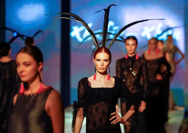 Models present creations by Kazakhstan's design house Khafiz Khan during Kazakhstan Fashion Week in Almaty, Kazakhstan, April 21, 2016. (Photo by Shamil Zhumatov/Reuters)