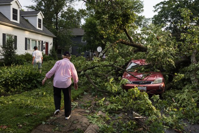 People observe storm damage along Peony Drive in Gaithersburg, Maryland after a tornado moved through the area the previous evening, on June 6, 2024. (Photo by Tom Brenner for The Washington Post)