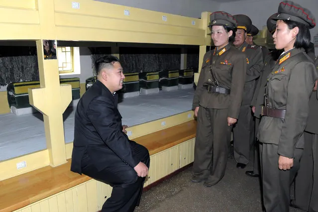 Photo released by Korean Central News Agency on Aug. 7, 2012 shows Kim Jong Un (L), top leader of the Democratic People's Republic of Korea (DPRK), talking to soldiers in a dormitory of a contingent of Unit 552 of the Korean People's Army on August 6, 2012. (Photo by KCNA/Xinhua/SIPA Press USA)