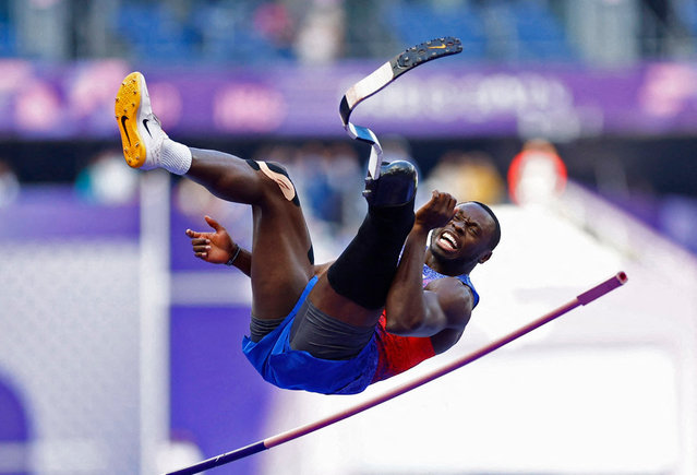 US high jumper Derek Loccident just clips the bar in the men’s T64 final on September 6, 2024. The American had to settle for silver with a best jump of 2.06m as India’s Kumar Praveen won gold. (Photo by Stéphanie Lecocq/Reuters)