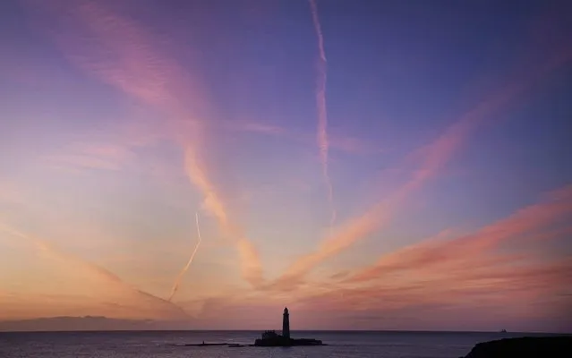 Stunning clouds at St Mary's Lighthouse in Whitley Bay on the North East coast of England before sunrise on September 17, 2019. (Photo by Owen Humphreys/PA Images via Getty Images)