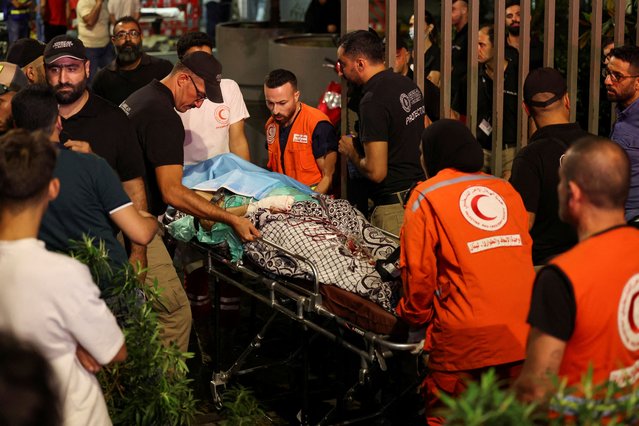 A person is carried on a stretcher outside American University of Beirut Medical Center (AUBMC) as people, including Hezbollah fighters and medics, were wounded and killed when the pagers they use to communicate exploded across Lebanon, according to a security source, in Beirut, Lebanon on September 17, 2024. (Photo by Mohamed Azakir/Reuters)