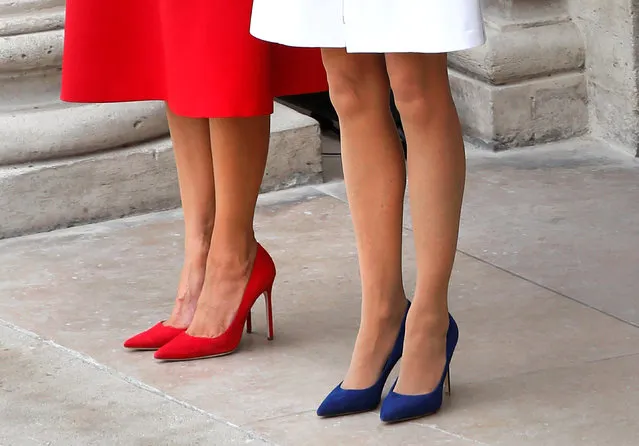 The shoes of Brigitte Macron (R), wife of French President Emmanuel Macron, and U.S. First Lady Melania Trump (L) are seen as they attend a welcoming ceremony at the Invalides in Paris, France, July 13, 2017. (Photo by Charles Platiau/Reuters)