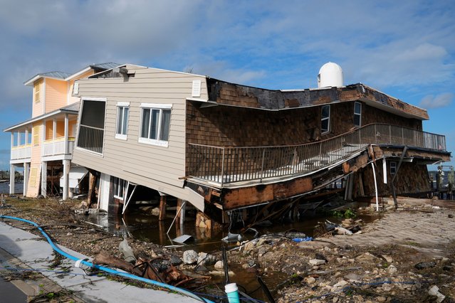 Houses lie in ruins after sustaining tornado and flood damage from Hurricane Milton, Thursday, October 10, 2024, in Matlacha, Fla. (Photo by Marta Lavandier/AP Photo)