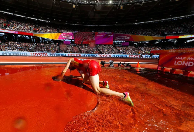 Spain' s Sebastian Martos falls at the water jump in the heats of the men' s 3,000 m steeplechase athletics event at the 2017 IAAF World Championships at the London Stadium in London on August 6, 2017. (Photo by Kai Pfaffenbach/Reuters)