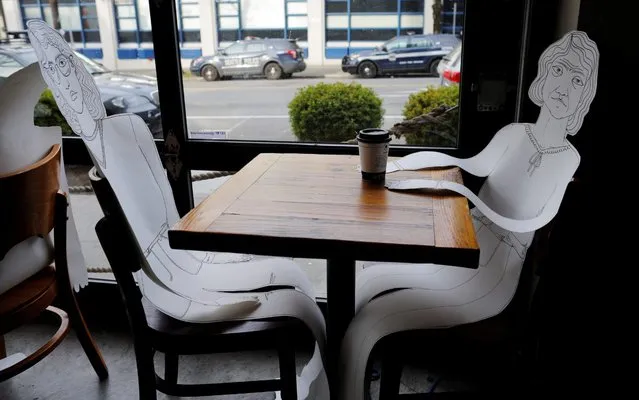 Paper cutouts of customers sit at he tables of Eltana, where only take out service is permitted amid the coronavirus disease (COVID-19) outbreak in Seattle, Washington, U.S., March 22, 2020. (Photo by Brian Snyder/Reuters)