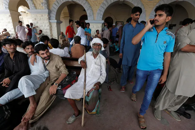 Passengers wait for their train to leave for hometown ahead of the Eid al-Fitr festival, at the Cantonment railway station in Karachi, Pakistan, July 5, 2016. (Photo by Akhtar Soomro/Reuters)