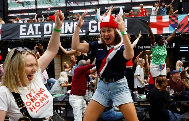 England football fans celebrate as England score their first goal during the UEFA Euro womens championship final on July 31, 2022 in London, United Kingdom. England take on Germany in the final of The UEFA European Women's Championship, played at Wembley Stadium. (Photo by Andrew Boyers/Reuters)