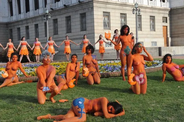 Dozens of women with body paintings take part in a demo in favour of the legalization of abortion in front of the Congress building in Montevideo on September 25, 2012. The Congress is voting a law project which would decriminilize the interruption of pregnancy under certain conditions, including obliging women to set out before a tribunal the reasons for the abortion.  AFP PHOTO/Miguel ROJO        (Photo credit should read MIGUEL ROJO/AFP/GettyImages)