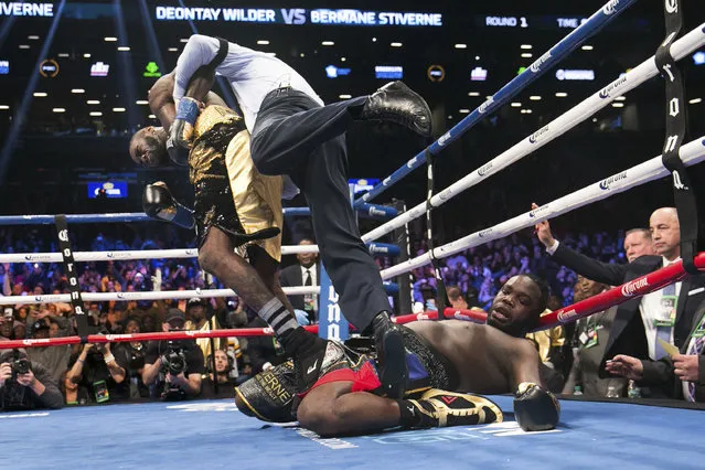 A referee pulls Deontay Wilder away from Bermane Stiverne after Wilder knocked out Stiverne during the WBC Heavyweight World Championship fight Saturday, November 4, 2017, in New York. (Photo by Kevin Hagen/AP Photo)