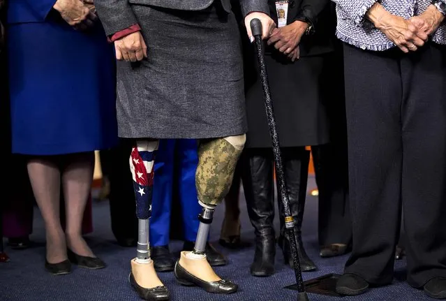 Rep.-elect Tammy Duckworth, from Illinois' 8th congressional district, is an Iraq War veteran who served as an Army helicopter pilot and suffered severe combat wounds, losing both of her legs. Duckworth joined other women House Democrats to support Minority Leader Nancy Pelosi, D-Calif., as she announced that she wants to remain as the top Democrat in the House of Representatives, during a press conference at the Capitol in Washington, November 14, 2012. (Photo by J. Scott Applewhite/Associated Press)
