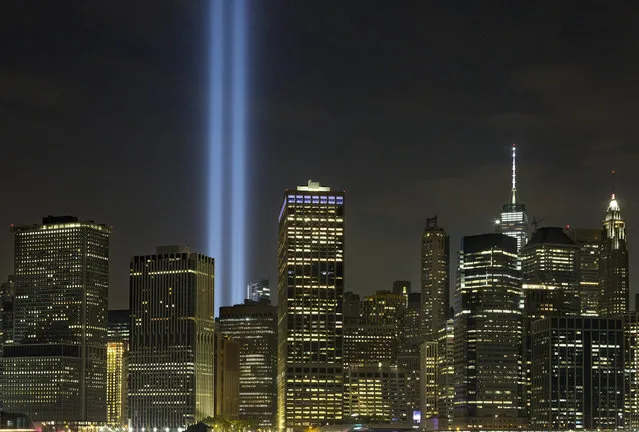 The Tribute in Light rises above the lower Manhattan skyline, Saturday, September 10, 2016, in New York. Sunday marks the fifteenth anniversary of the terrorist attacks of Sept. 11, 2001on the United States. (Photo by Mark Lennihan/AP Photo)