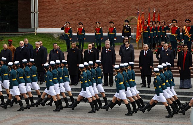 Heads of foreign delegations, led by Russia's President Vladimir Putin, watch Russian service members marching past during a flower-laying ceremony at the Tomb of the Unknown Soldier on Victory Day, marking the 80th anniversary of the victory over Nazi Germany in World War Two, in central Moscow, Russia, on May 9, 2025. (Photo by Evgenia Novozhenina/Reuters)