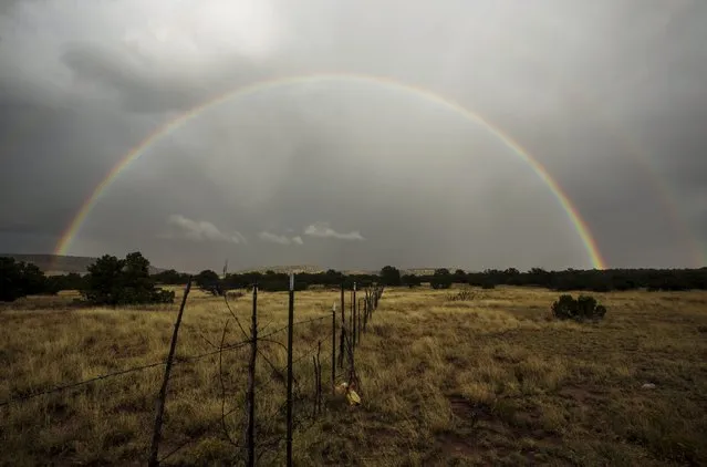 A rainbow forms after a passing rain shower near Grants, New Mexico, October 5, 2015. (Photo by Lucas Jackson/Reuters)