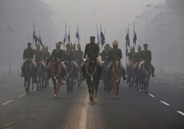 Members of Kolkata Mounted Police take part in a rehearsal for the Republic Day parade on a foggy winter morning in Kolkata, January 17, 2018. (Photo by Rupak De Chowdhuri/Reuters)