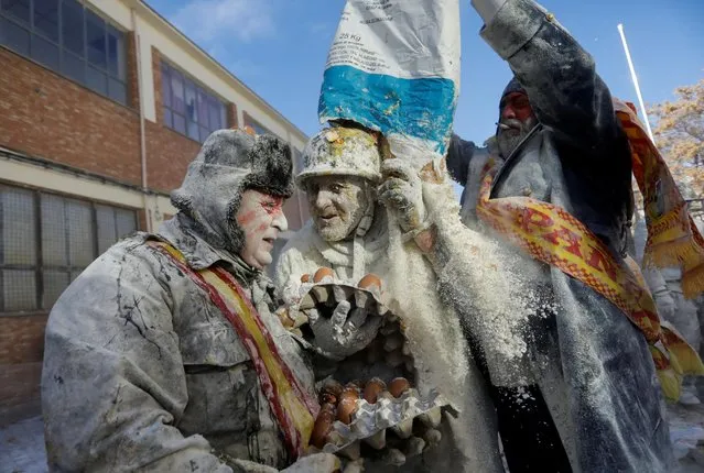Revellers take part in the traditional “Els Enfarinats” (The Floured) festival, in the town of Ibi, Alicante Province, Spain on December 28, 2022. (Photo by Eva Manez/Reuters)