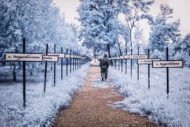 This fascinating photo series looks at the bleak isolation of Chernobyl as never before. Employing infrared filters, photographer Vladimir Mitgutin is able to bring out details of decay – an abandoned bus, a radar system, an amusement park, a doll, a sports hall, a piano – frozen in time. The filtered red hues make them pop out against icy backdrops. Mitgutin, 32, recently released the series to the public after visiting the site in July 2017. It was a spontaneous trip, the photographer said, with the sole intention of telling a different story about the site of the 1986 catastrophe. Here: The monumental trail with the evacuated village names by the side. (Photo by Vladimir Mitgutin/Caters News Agency)