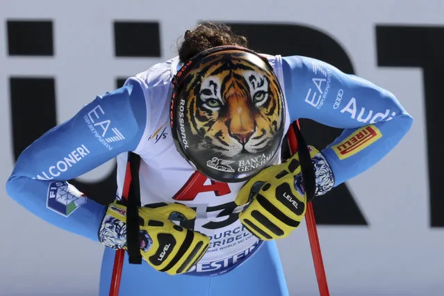A tiger is depicted on the helmet of Italy's Federica Brignone at the finish area of an alpine ski, women's World Championships super G, in Meribel, France, Wednesday, February 8, 2023. (Photo by Marco Trovati/AP Photo)