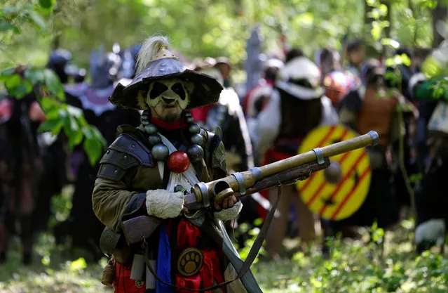 People dressed as characters from the computer game “World of Warcraft” stand in a forest near the town of Kamyk nad Vltavou, Czech Republic, April 28, 2018. (Photo by David W. Cerny/Reuters)