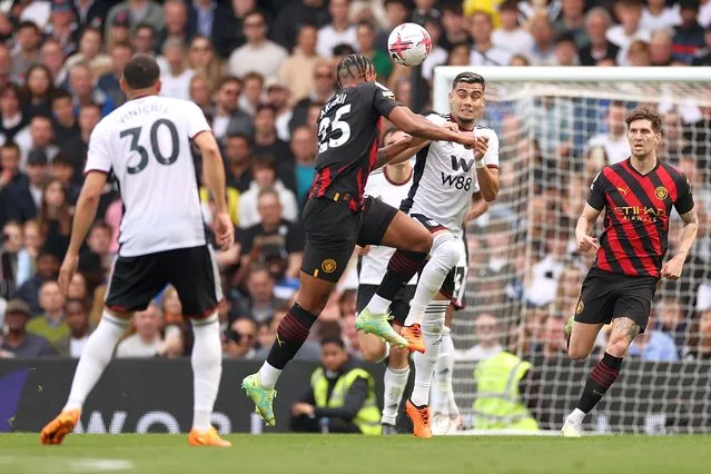 Andreas Pereira of Fulham collides with Manuel Akanji of Manchester City during the Premier League match between Fulham FC and Manchester City at Craven Cottage on April 30, 2023 in London, England. (Photo by Ryan Pierse/Getty Images)