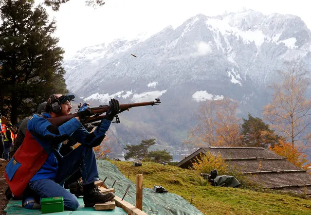A participant reloads his infantry rifle during the traditional “Ruetlischiessen” (Ruetli shooting) competition at the Ruetli meadow in central Switzerland November 9, 2016. (Photo by Arnd Wiegmann/Reuters)