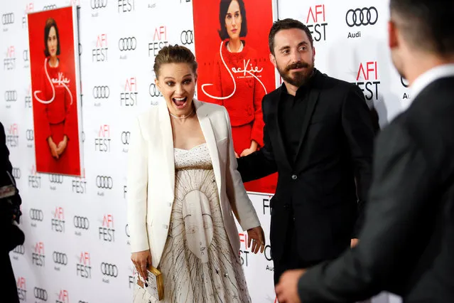 Actor Natalie Portman (L), who is pregnant and portrays Jacqueline Kennedy, reacts next to director Pablo Larrain (R) as she sees other co-stars at a screening of “JACKIE” as a part of AFI Fest in Los Angeles, California, U.S. November 14, 2016. (Photo by Danny Moloshok/Reuters)