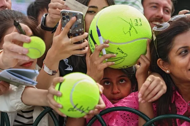 Fans attempt to get autographs and pictures from Carlos Alcaraz of Spain after practice on day nine of The Championships Wimbledon 2023 at All England Lawn Tennis and Croquet Club on July 11, 2023 in London, England. (Photo by Patrick Smith/Getty Images)