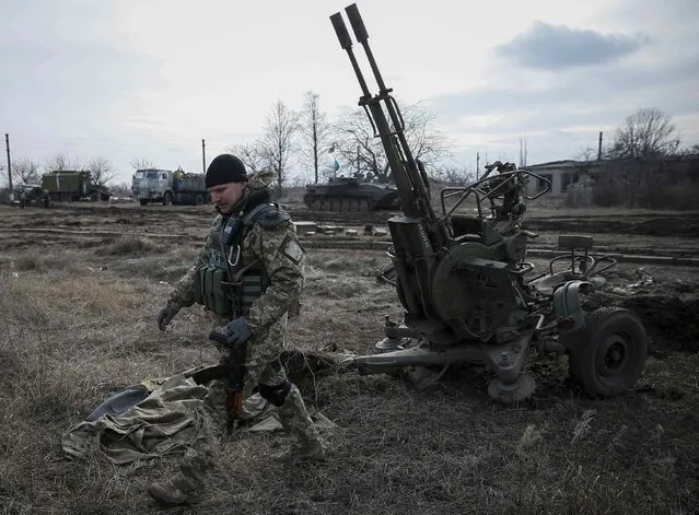 A Ukrainian serviceman is pictured at his position near Debaltseve, eastern Ukraine, February 8, 2015. (Photo by Gleb Garanich/Reuters)