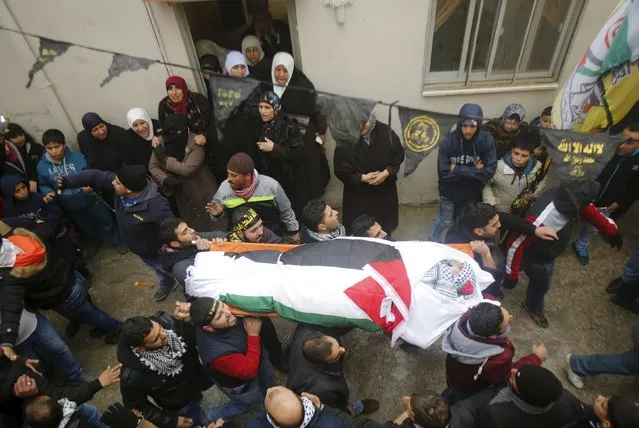 Mourners carry the body of a 16-year-old Palestinian girl Ashraqat Qatanani, who allegedly carried out an attack against Israelis, after her body was released by Israel, during her funeral in Askar refugee camp near the West Bank city of Nablus January 3, 2016. (Photo by Abed Omar Qusini/Reuters)