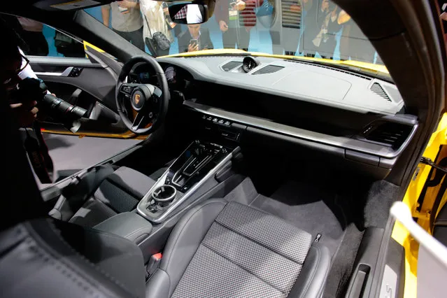 The interior of the 2020 Porsche 911 Carrera 4S is displayed during a Porsche press conference at the Los Angeles Auto Show in Los Angeles on November 28, 2018. (Photo by Kyle Grillot/Reuters)