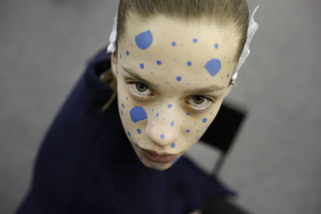Portuguese model Sigrid Vieira poses for a photograph after having her make-up applied backstage during the first day of the Portugal Fashion Fall-Winter 2015-16, in Lisbon, Wednesday, March 25, 2015. (Photo by Francisco Seco/AP Photo)