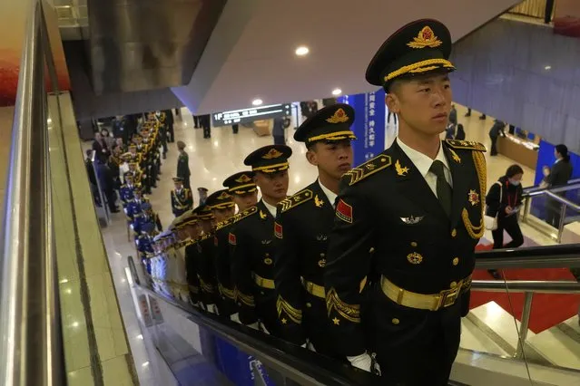 Members of a Chinese honor guard ride an escalator at the 10th Beijing Xiangshan Forum held in Beijing, Monday, October 30, 2023. The Beijing event, attended by military representatives from dozens of countries, is an occasion for China to project regional leadership and boost military cooperation. (Photo by Ng Han Guan/AP Photo)