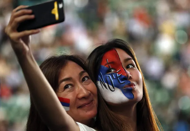 Supporters of Novak Djokovic of Serbia take a selfie during the Men's Final at the Australian Open tennis tournament in Melbourne, Australia, 31 January 2016. (Photo by Mast Irham/EPA)