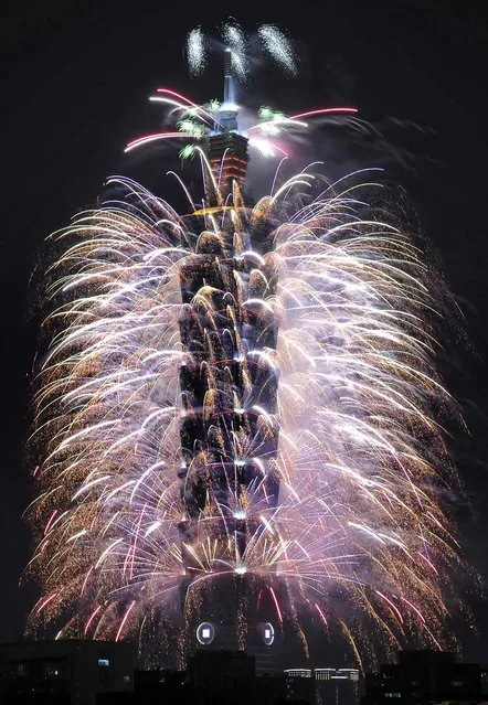 Fireworks explode from Taiwan's tallest skyscraper, the Taipei 101 tower, during New Year celebrations in Taipei. (Photo by Edward Lau/Reuters)