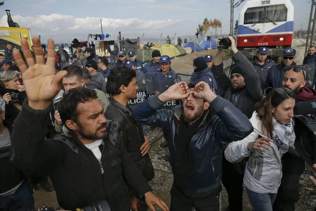 Migrants shout slogans as they block the railway track at the Greek-Macedonian border, near the village of Idomeni, Greece March 3, 2016. (Photo by Marko Djurica/Reuters)