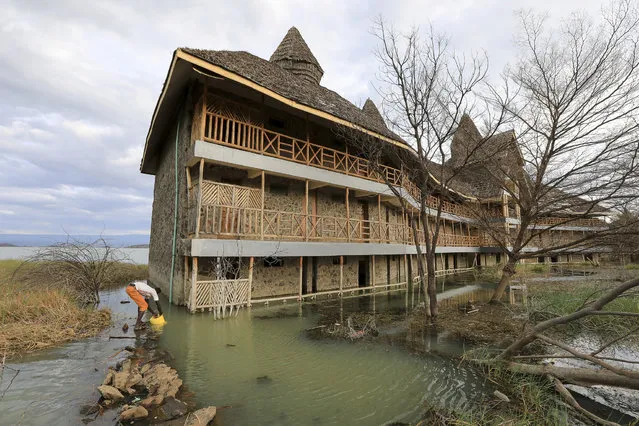 A section of the submerged luxury Soi Safari Lodge, an 80-room resort that once employed 300 locals, at Kampi ya Samaki, after it was flooded due to unprecedented rise of water levels in Lake Baringo in Baringo County, Kenya, 21 October 2021 (issued 25 October 2021). Thousands of people have been displaced from their homes and places of work, some have already been forced to migrate to neighboring towns due to the flooding situation in all eight lakes in Kenya's Rift Valley in which experts note has not been witnessed in the last 50 years. And some of the reasons they say include but are not limited to an unprecedented increase in annual rainfall over the past decade widely attributed to climate change, pressure on land, and siltation. Some of the lakes have nearly doubled in size, drowning homes, schools, clinics, pastureland, businesses, farms, and churches. Environmental organizations have kept calling on world leaders to put more effort into addressing the effects of climate change as the UK prepares to host the 26th UN Climate Change Conference of the Parties (COP26) in Glasgow from 31 October to 12 November 2021. (Photo by Daniel Irungu/EPA/EFE)