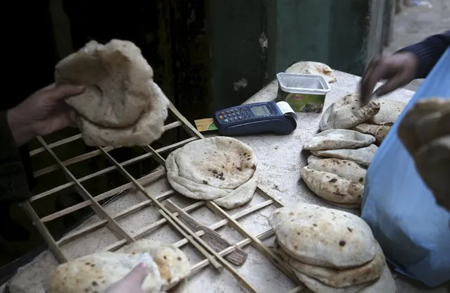 A smart card unit used by customers to pay for subsidised bread is seen at a bakery in Cairo, Egypt, February 9, 2016. (Photo by Asmaa Waguih/Reuters)