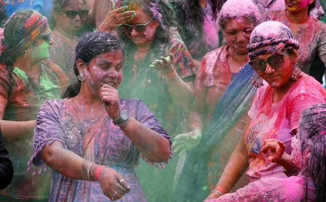 People daubed with color powders take part in the Hindu Holi Festival celebrated as the Festival of Colors, Love, and Spring in Nairobi, Kenya, on March 24, 2024. (Photo by Thomas Mukoya/Reuters)