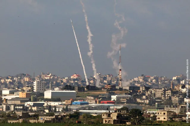 Palestinian rockets are seen as they are launched from Hamas-controlled Gaza