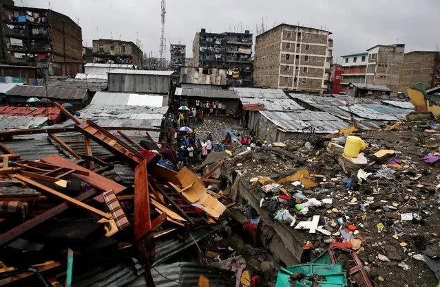 A general view shows rescue workers searching for residents feared trapped in the rubble of a six-storey building that collapsed after days of heavy rain in Nairobi, Kenya, May 1, 2016. (Photo by Thomas Mukoya/Reuters)