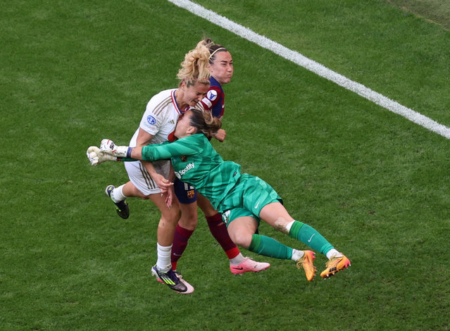 FC Barcelona's Catalina Coll and Lucy Bronze in action with Olympique Lyonnais' Lindsey Horan during their women's Champions League final in Bilbao, Spain on May 25, 2024. (Photo by Violeta Santos Moura/Reuters)