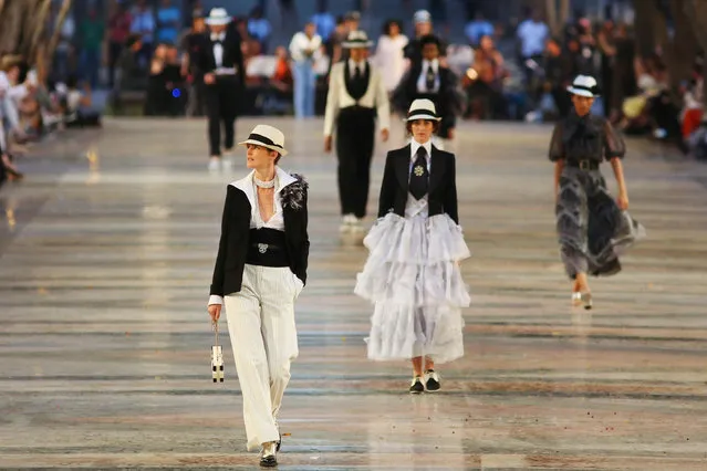 Models present creations by German designer Karl Lagerfeld as part of his latest inter-seasonal Cruise collection for fashion house Chanel at the Paseo del Prado street in Havana, Cuba, May 3, 2016. (Photo by Alexandre Meneghini/Reuters)