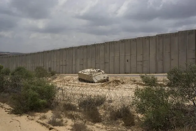 In this Thursday, June 25, 2015 photo, an Israeli APC (Armored Personnel Carrier) is parked on the Israel-Gaza border in Netiv Haasara. (Photo by Oded Balilty/AP Photo)