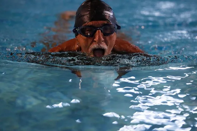 Fernando Sergio Paneque, 80, swims during the Campeonato Nacional de Natacion Master (National Master Swimming Championship) in Havana, Cuba, February 6, 2022. (Photo by Amanda Perobelli/Reuters)