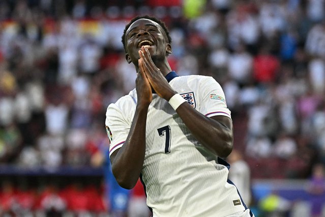 England's forward #07 Bukayo Saka reacts after having a goal disallowed for offside during the UEFA Euro 2024 Group C football match between England and Slovenia at the Cologne Stadium in Cologne on June 25, 2024. (Photo by Javier Soriano/AFP Photo)