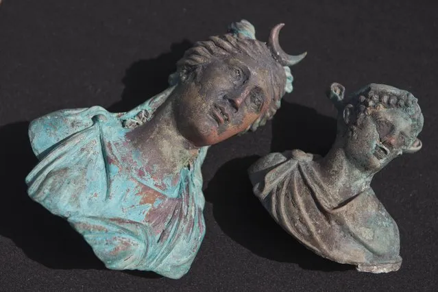 Rare bronze artifacts, part of a large ancient marine cargo of a merchant ship that sank during the Late Roman period 1,600 years ago are seen during a presentation of the Israel Antiquities Authority in Caesarea, Israel, Monday, May 16, 2016. Israeli archeologists say two divers have made the country' biggest discovery of Roman-era artifacts in three decades. (Photo by Dan Balilty/AP Photo)