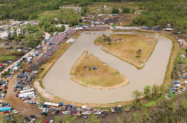 The Mile O' Mud is a 7/8-mile oval track with a 1/8-mile diagonal lane slashed through the center. The racing lanes are approximately 60 feet wide. On average, the muddy water is four to six feet deep, with three strategically placed holes. The largest hole, located in front of the grandstand, is the treacherous “Sippy Hole”, named for the legendary driver “Mississippi” Milton Morris, Swamp Buggy King 1955, who repeatedly got stuck in it. (Photo by Malcolm Lightner)