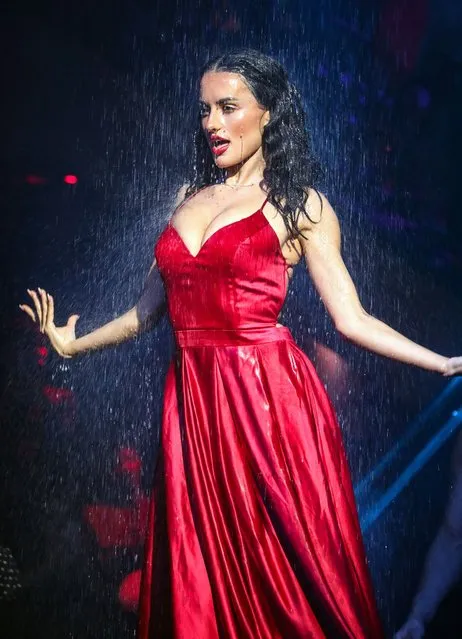 The UK reality star-turned-actress Amber Davies, 25, got drenched as she returned to the stage in Cabaret All Stars at Proud Embankment, in central London in the second decade of March 2022. (Photo by Splash News and Pictures)