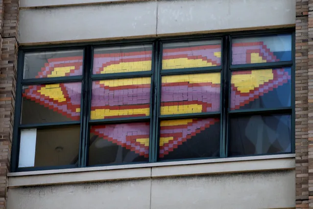 An image of the Superman Logo created with Post-it notes is seen in windows at 200 Hudson street in lower Manhattan, New York, U.S., May 18, 2016. (Photo by Mike Segar/Reuters)